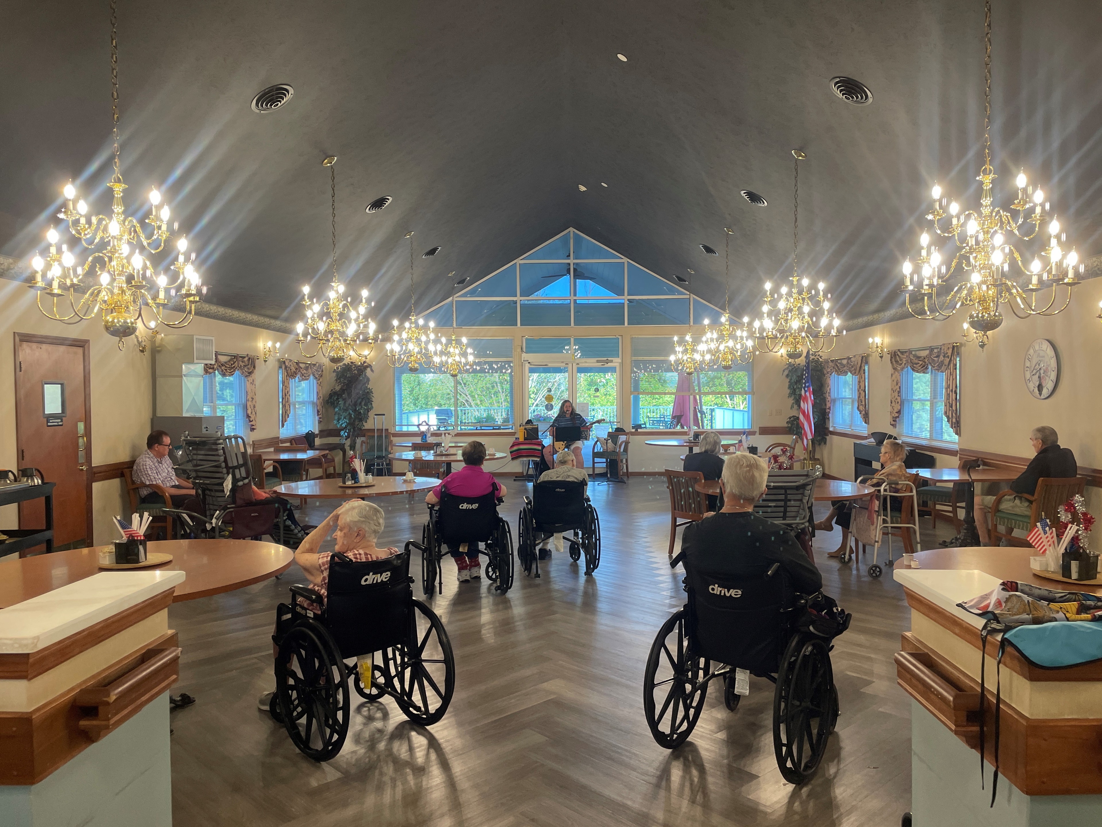 Dining room with vaulted ceilings and elegant lighting at Golden Heights